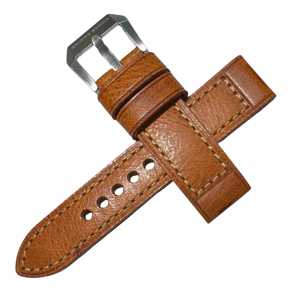 Brown leather watch strap with silver buckle on a white background