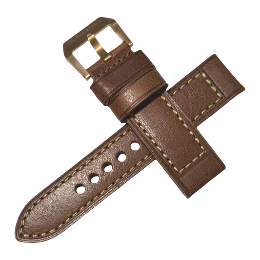 Brown leather watch strap with gold buckle on a white background