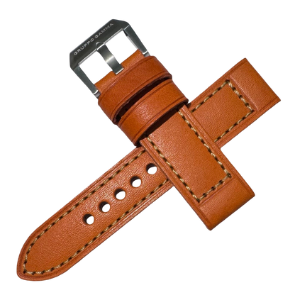 Brown leather watch strap with silver buckle on a white background