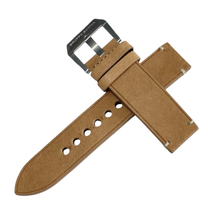 Brown leather watch strap with silver buckle on a white background