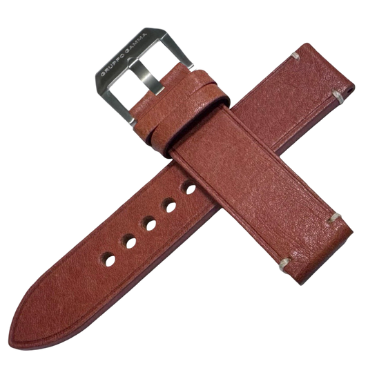 Brown leather watch strap with silver buckle on a white background