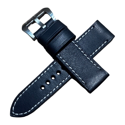 Black leather watch strap with silver buckle on a white background