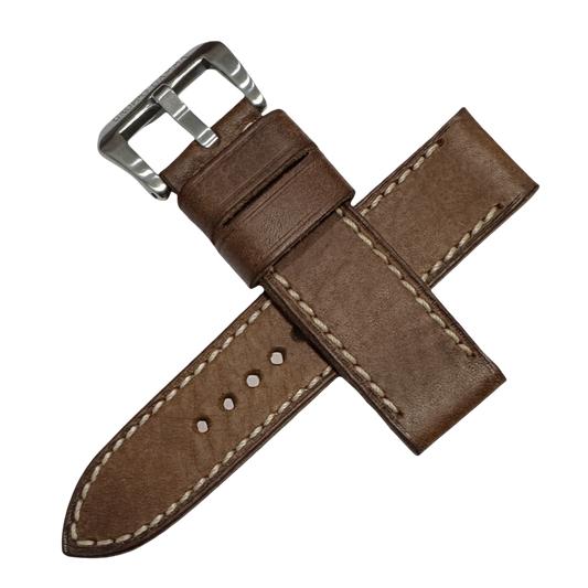 A brown leather watch strap with a silver-tone metal buckle, featuring light beige contrast stitching and pre-drilled holes, shown on a plain white background.