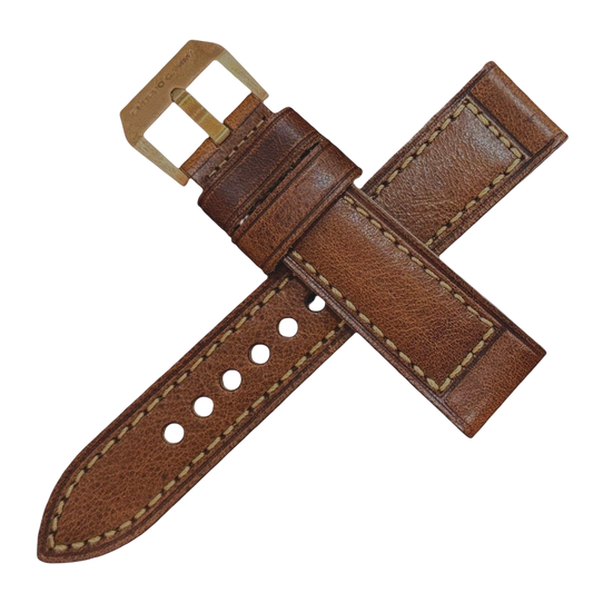 Brown leather watch strap with gold buckle on a white background