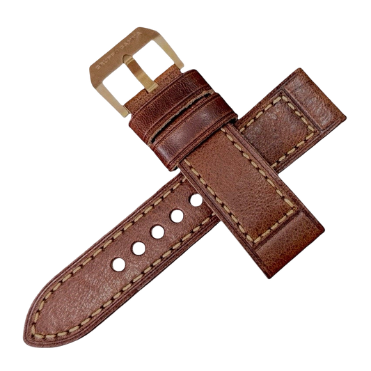 Brown leather watch strap on a white background