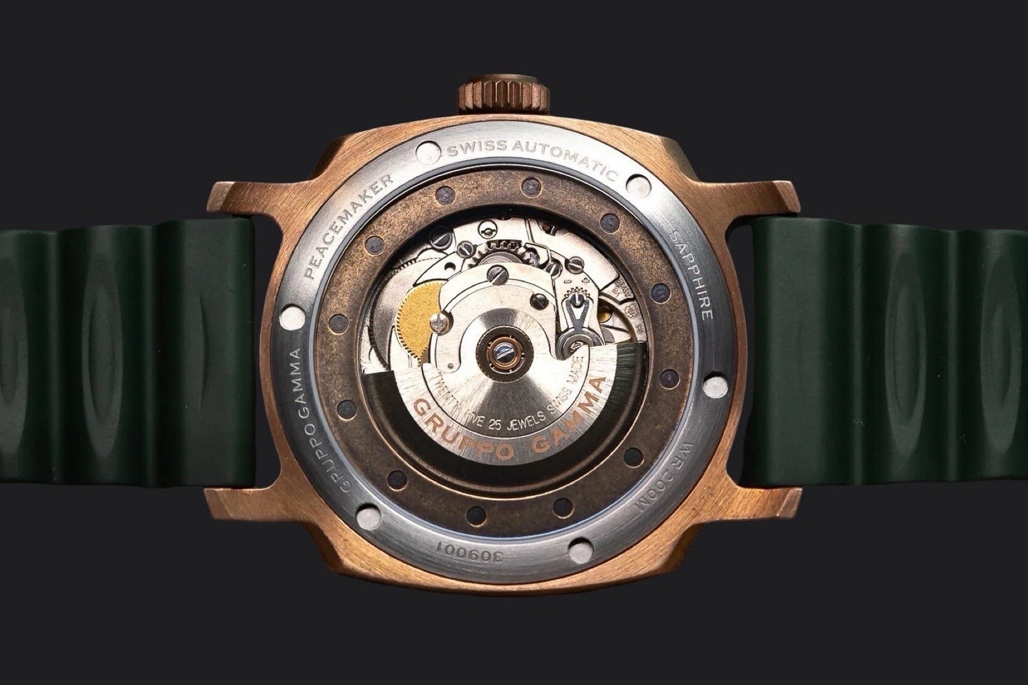 Close-up of a mechanical watch with visible brand name Gruppo Gamma on a black background