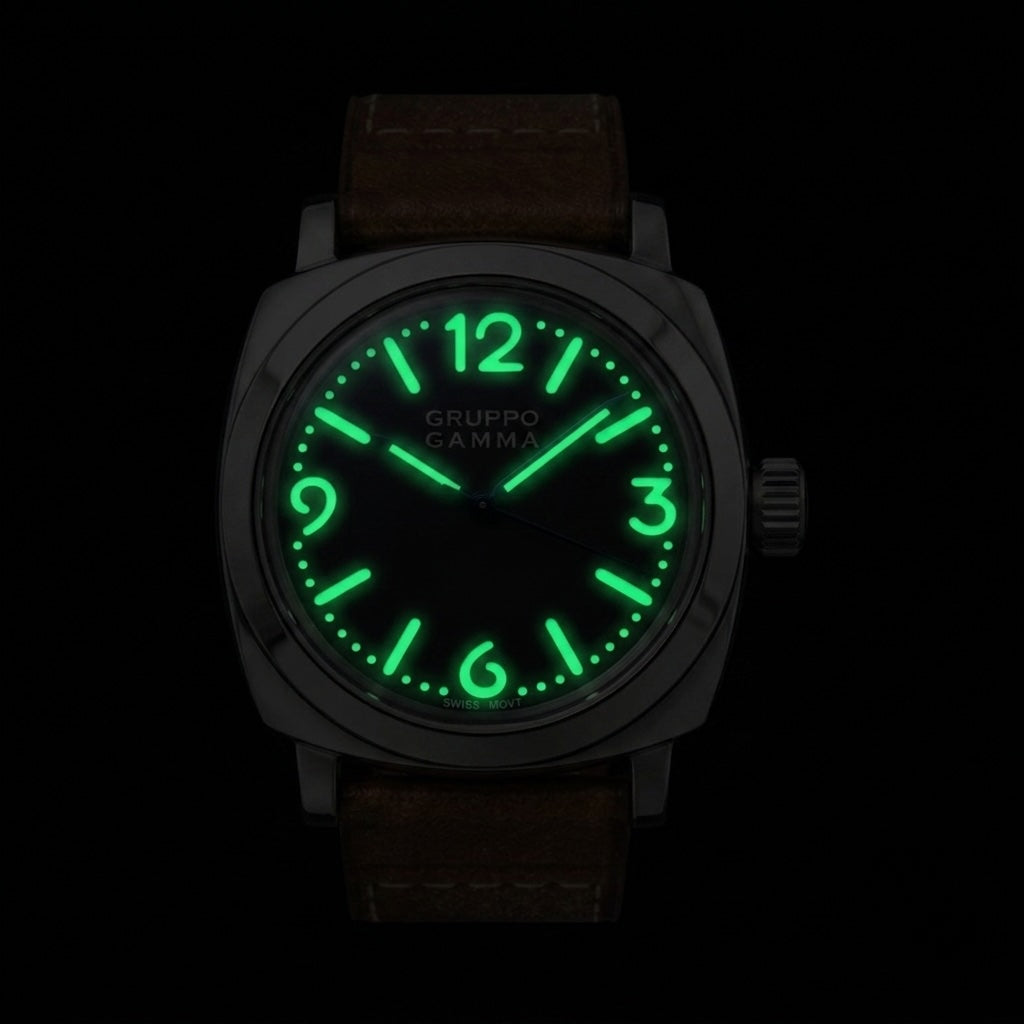 A wristwatch with a steel case, brown leather strap, and a glowing green luminescent dial and markers.