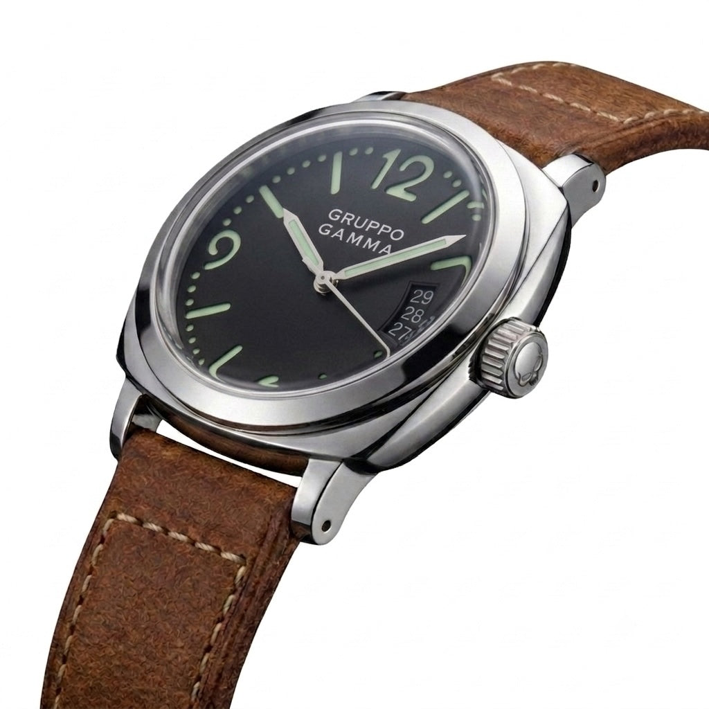 A close-up shot of a Gruppo Gamma wristwatch featuring a black dial, silver-tone stainless steel case, and a brown leather strap on a white background.