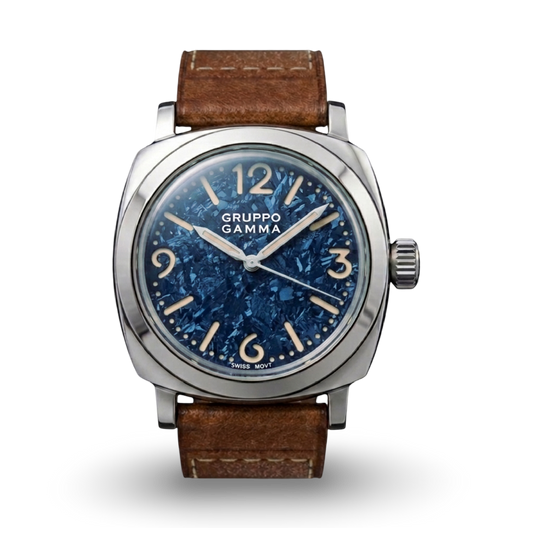 A Gruppo Gamma wristwatch with a steel cushion-shaped case, blue crystallised titanium dial, and a brown leather strap.