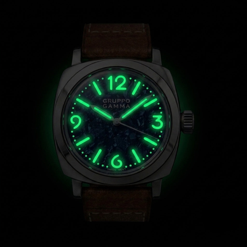 A Gruppo Gamma wristwatch with a dark brown leather strap and featuring bright green luminescent hour markers and hands, shown against a black background.
