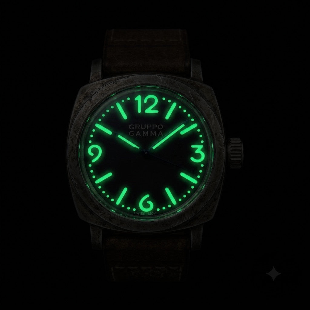 A Gruppo Gamma wristwatch with an aged steel case and a glowing green luminescent dial and numerals, shown against a solid black background.