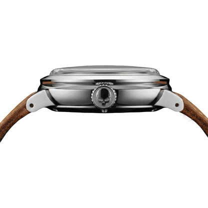 Close-up side view of a wristwatch with a polished stainless steel case and a brown leather strap on a white background.