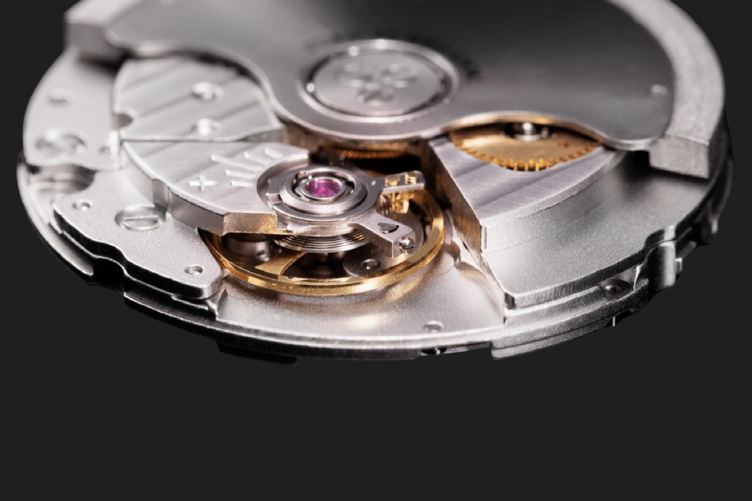 Close-up of a watch mechanism on a black background