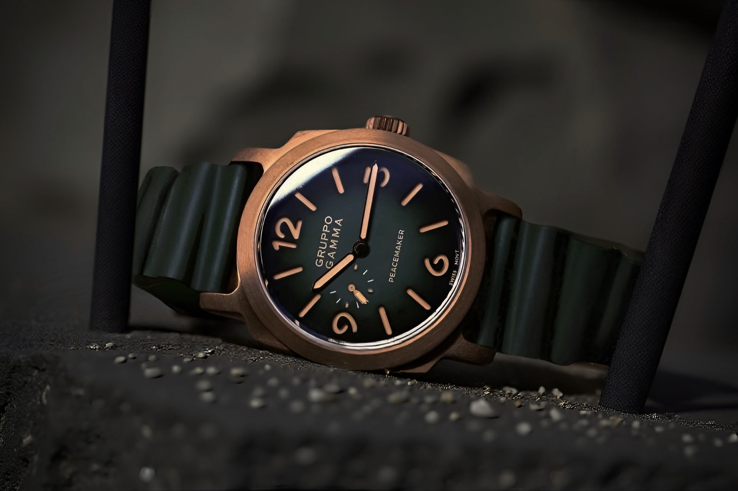 Watch with a dark face and bronze case on a black background