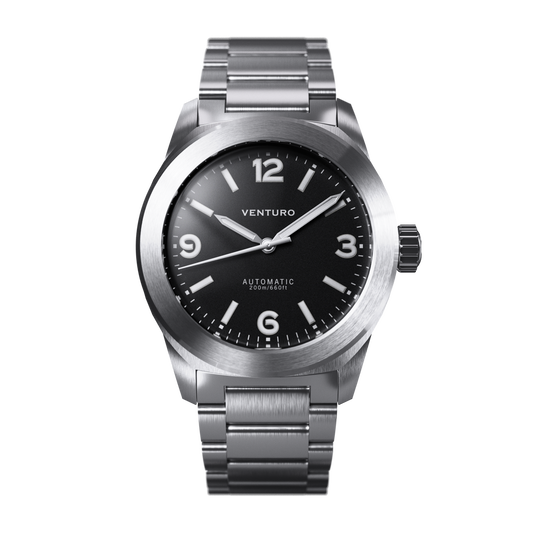 Silver watch with black dial on a white background