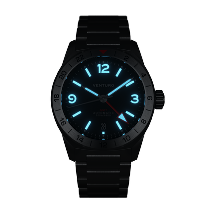 Black wristwatch with glowing blue face on a white background