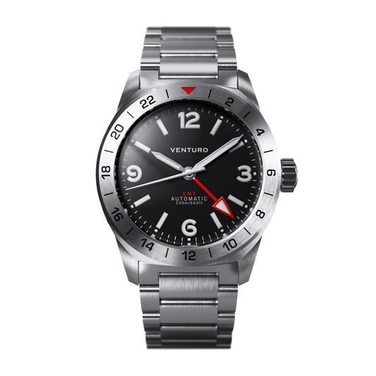 Venturo watch with black dial and silver metal strap on a white background