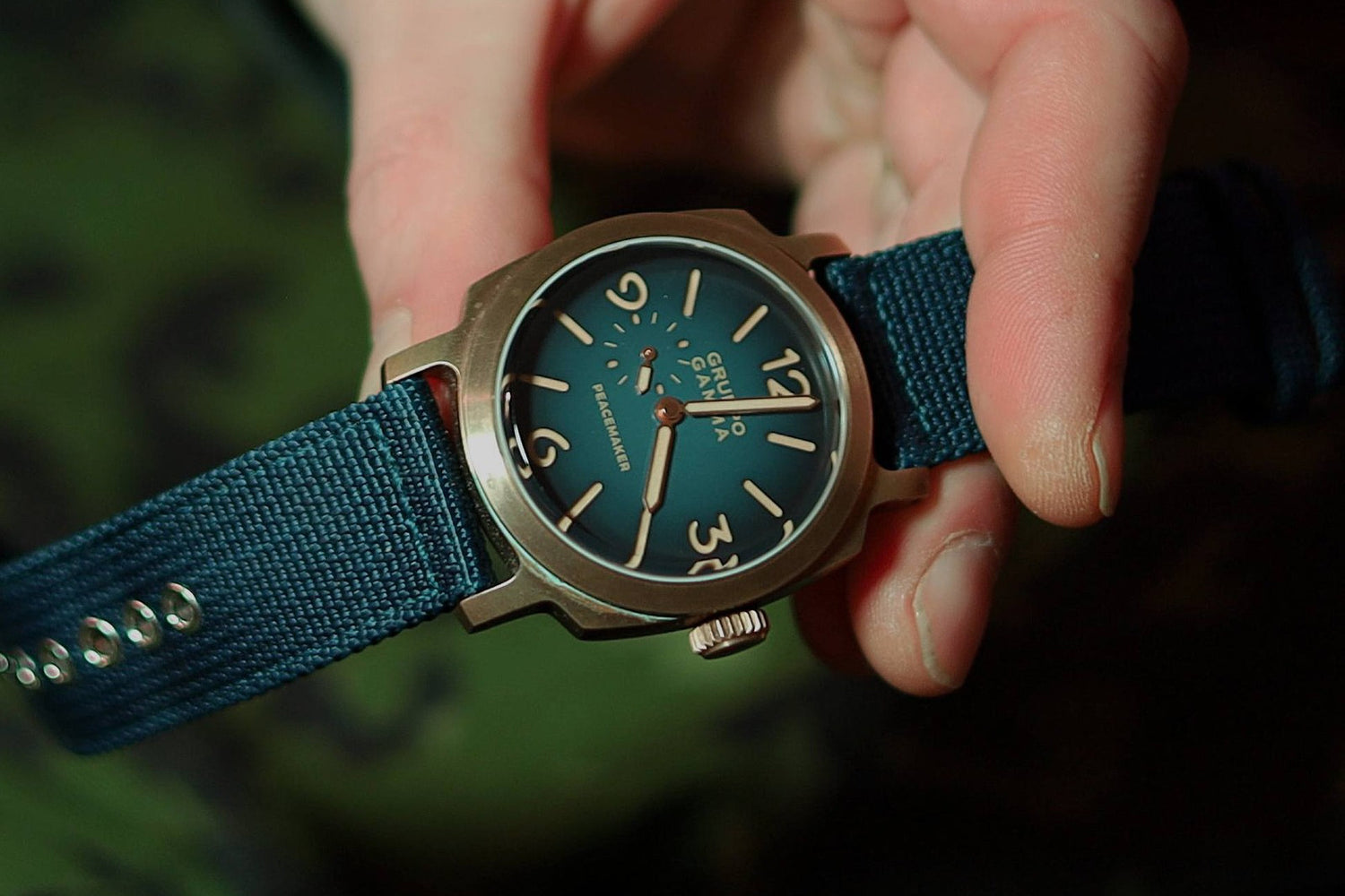 bronze watch with a canvas strap